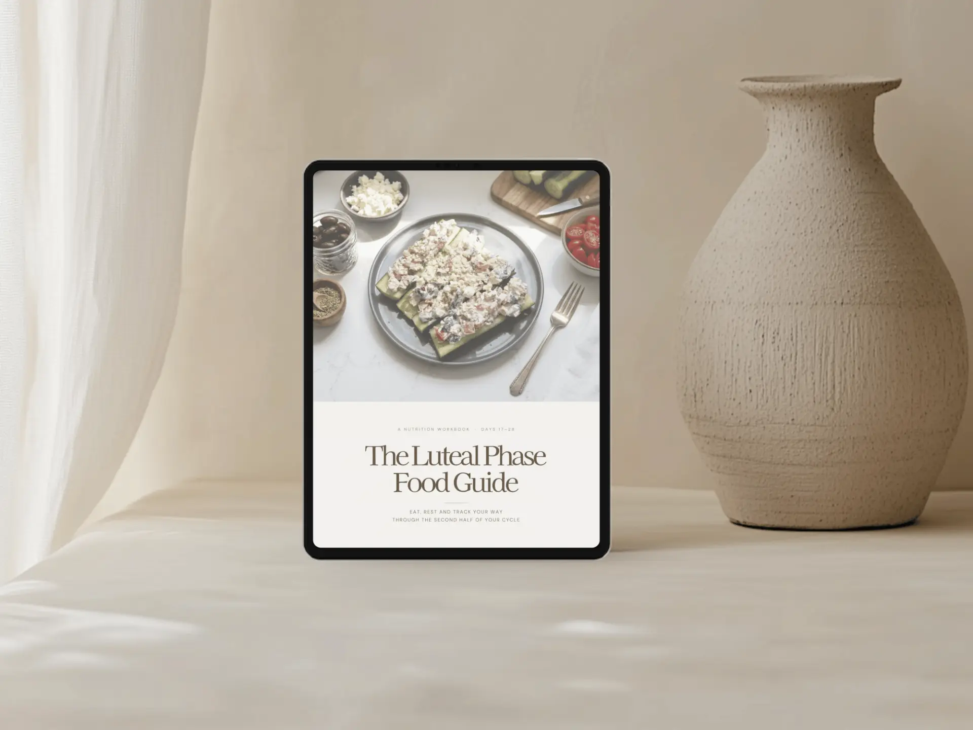 A workbook template shown on a tablet beside studio tutorials